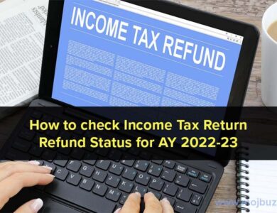 A person hand on laptop and income tax refund written on the screen