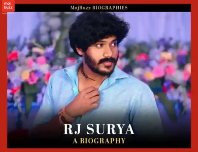 A man (Rj Surya) wearing blue t-shirt standing in pose for photo