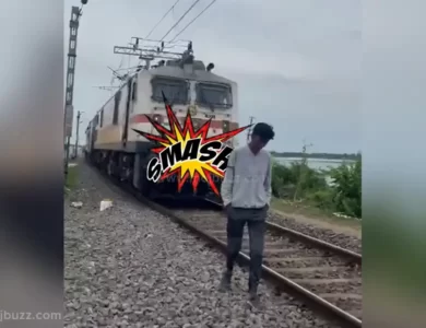 A boy walking in front of high speed train